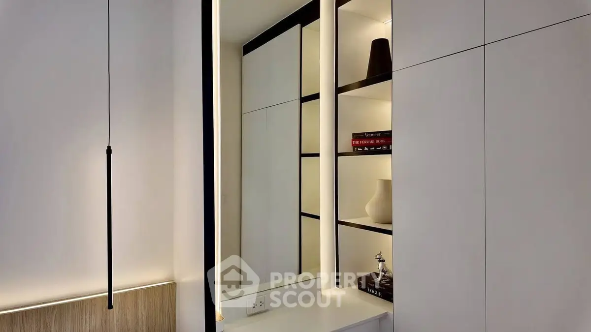 Modern interior with sleek built-in storage and elegant lighting