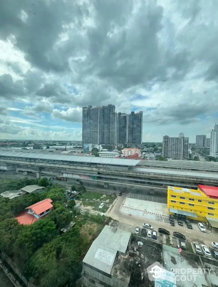 Stunning cityscape view from high-rise building with cloudy sky