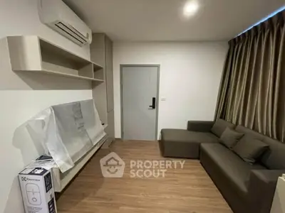 Modern living room with air conditioning and sleek furniture in a cozy apartment.