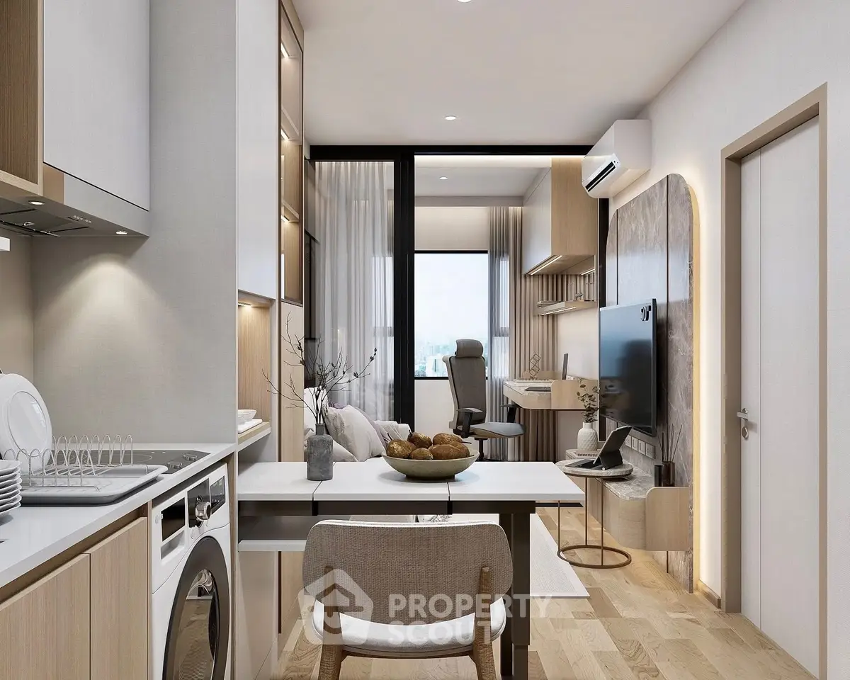 Modern open-plan living space with kitchen, dining, and study area, featuring sleek design and natural light.