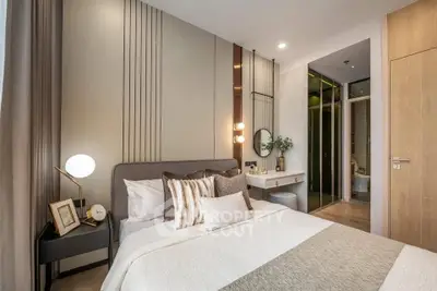 Luxurious modern bedroom with elegant decor and ensuite bathroom, perfect for relaxation and comfort.