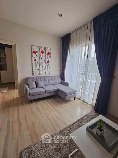 Modern living room with stylish decor and natural light in a contemporary apartment.