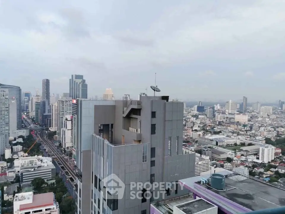 Stunning cityscape view from a high-rise building showcasing urban skyline and modern architecture.