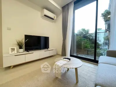 Modern living room with sleek furniture and garden view balcony.