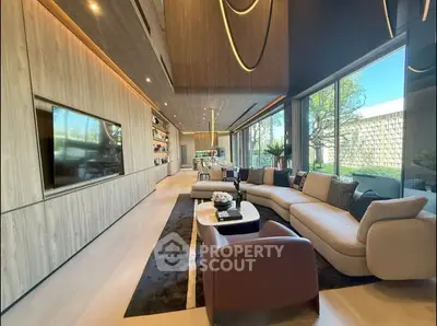 Luxurious modern living room with large windows and stylish decor