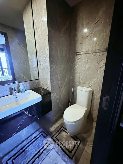 Luxurious bathroom with modern fixtures and elegant marble walls