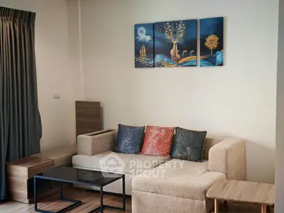 Modern living room with stylish sofa and artistic wall decor