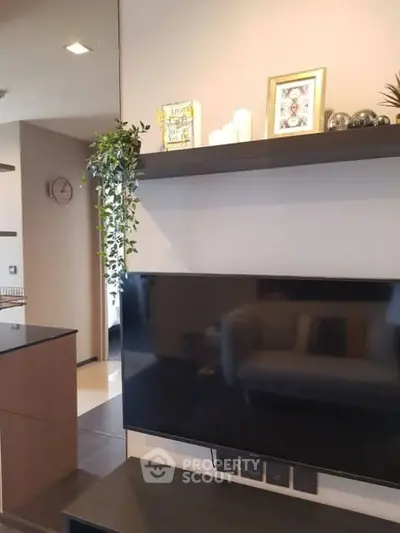 Modern living room with wall-mounted TV and stylish decor