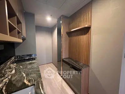 Modern kitchen with sleek marble countertops and elegant cabinetry