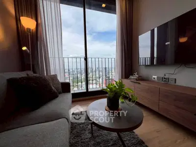 Modern living room with stunning city view from large window, cozy sofa, and stylish decor.