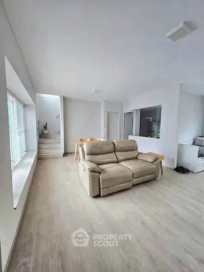 Spacious modern living room with sleek design and natural light