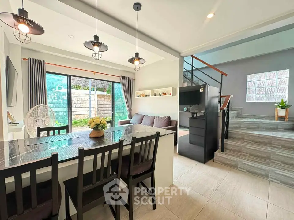 Stylish open-plan living room with modern dining area and garden view
