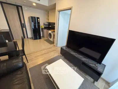 Modern living room with sleek furniture and integrated kitchen appliances
