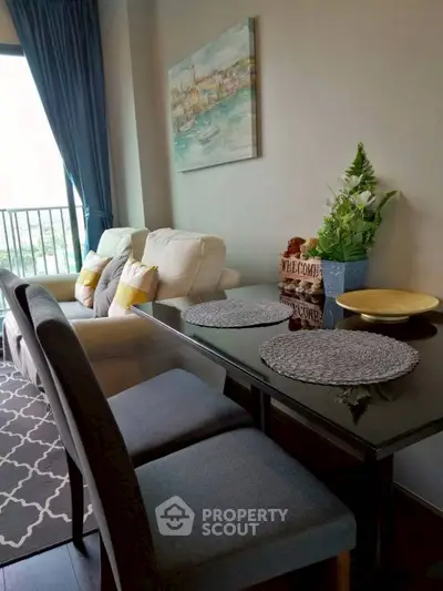 Stylish living room with elegant dining area and cozy seating, perfect for modern urban living.