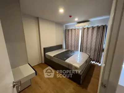 Modern bedroom with new bed and stylish curtains in a cozy apartment