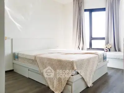 Bright and airy bedroom with modern decor and large window