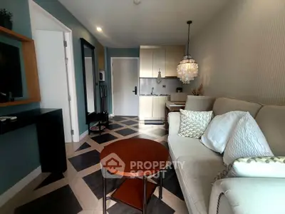 Stylish modern living room with chic decor and open kitchen layout