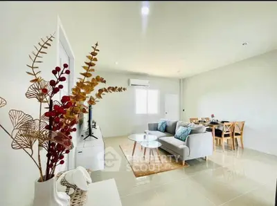 Spacious modern living room with elegant decor and dining area
