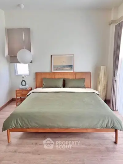 Modern bedroom with stylish wooden bed and minimalist decor