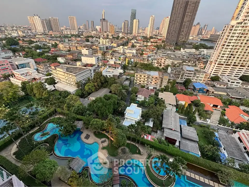 Stunning cityscape view with luxurious pool and lush greenery in a vibrant urban setting.