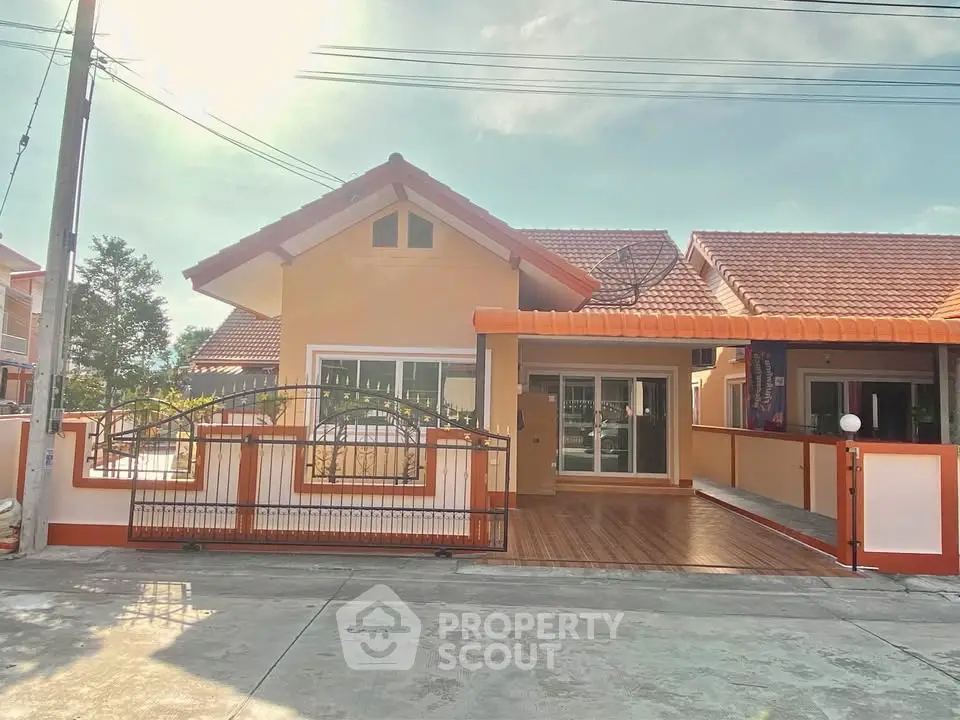 Charming single-story house with tiled roof and spacious driveway in sunny neighborhood.