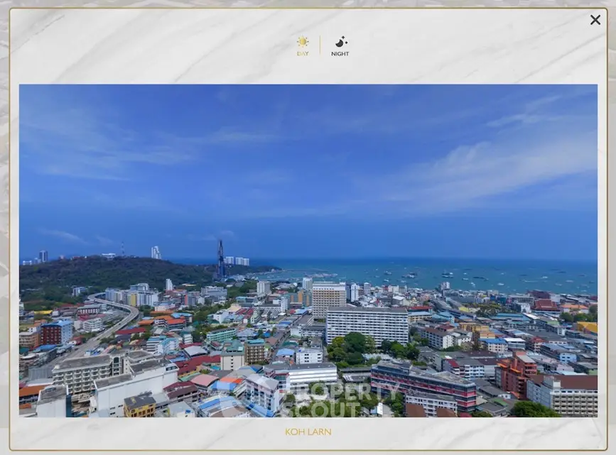 Stunning aerial view of Koh Larn showcasing vibrant cityscape and expansive ocean horizon.