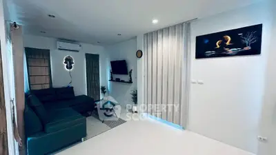 Modern living room with sleek design and cozy seating area