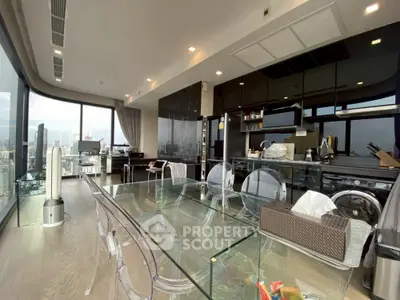 Luxurious modern kitchen with glass dining table and stunning city view