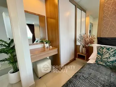 Stylish bedroom with modern decor and built-in wardrobe