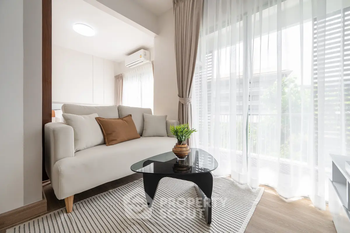 Bright and modern living room with large windows and stylish furniture