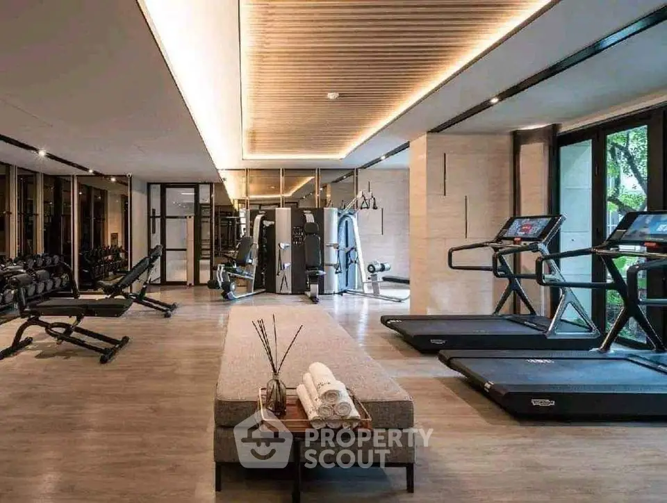 Luxurious modern gym with state-of-the-art equipment and elegant design.