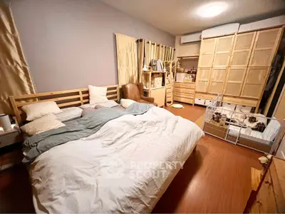Cozy bedroom with wooden furniture and pet-friendly space