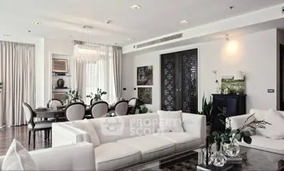 Luxurious open-plan living and dining area with elegant decor and modern furnishings.