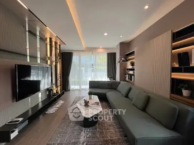 Modern living room with sleek design and large windows for natural light.
