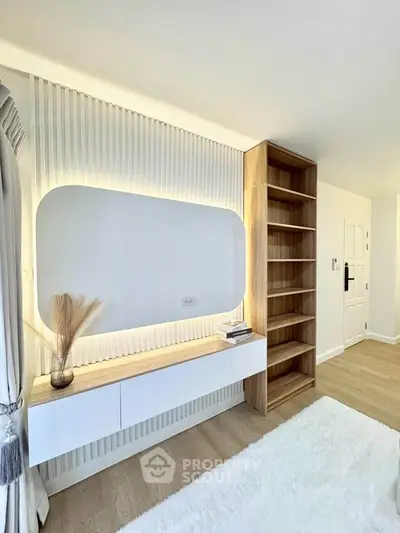 Modern minimalist living room with built-in shelving and soft lighting