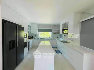 Modern kitchen with sleek white cabinetry and large island