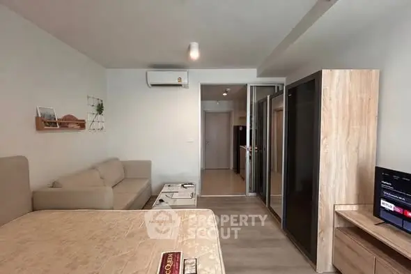 Cozy studio apartment with modern furnishings and open layout