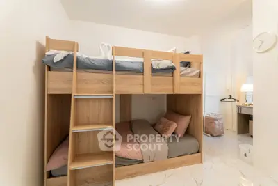 Modern bedroom with stylish wooden bunk beds and cozy decor