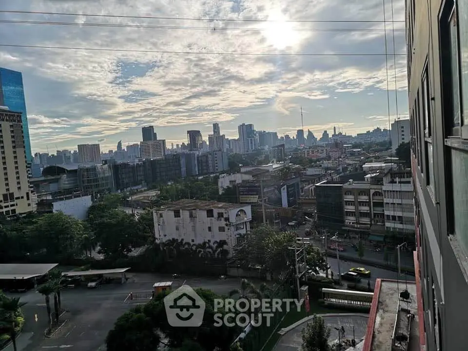 Stunning cityscape view from a high-rise building showcasing urban skyline and vibrant city life.