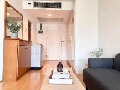 Modern living room with sleek furniture and stylish decor in a cozy apartment.