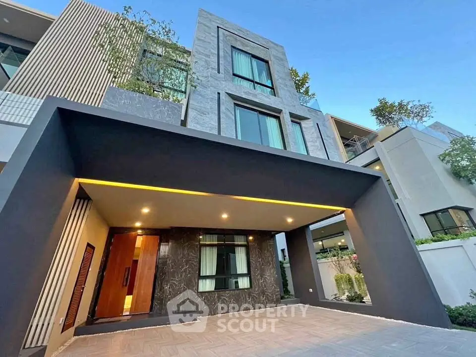 Modern luxury home exterior with sleek design and spacious driveway