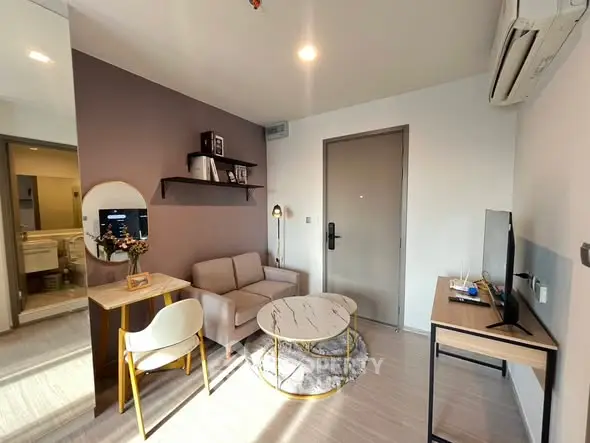 Modern living room with stylish furniture and natural light, perfect for cozy living.