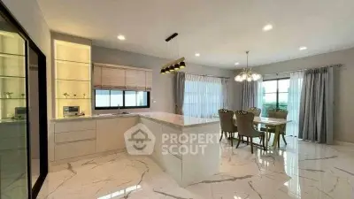 Spacious modern kitchen with marble flooring and elegant dining area