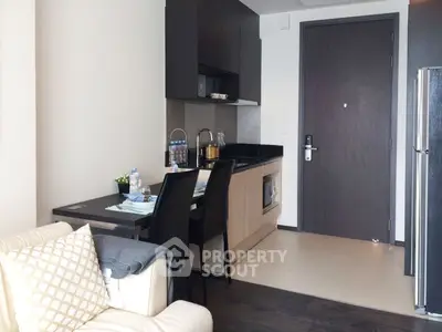 Modern compact kitchen with dining area in a cozy apartment