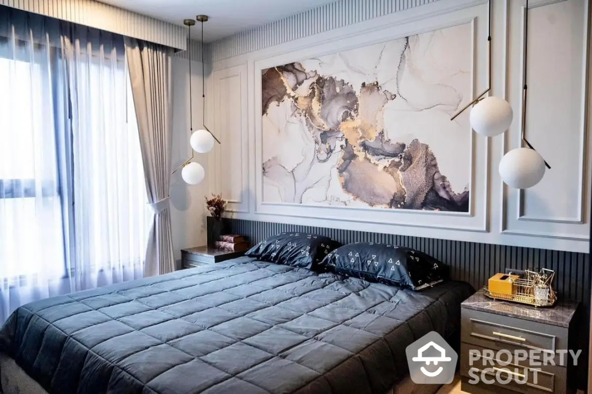 Luxurious modern bedroom with elegant decor and large abstract art piece