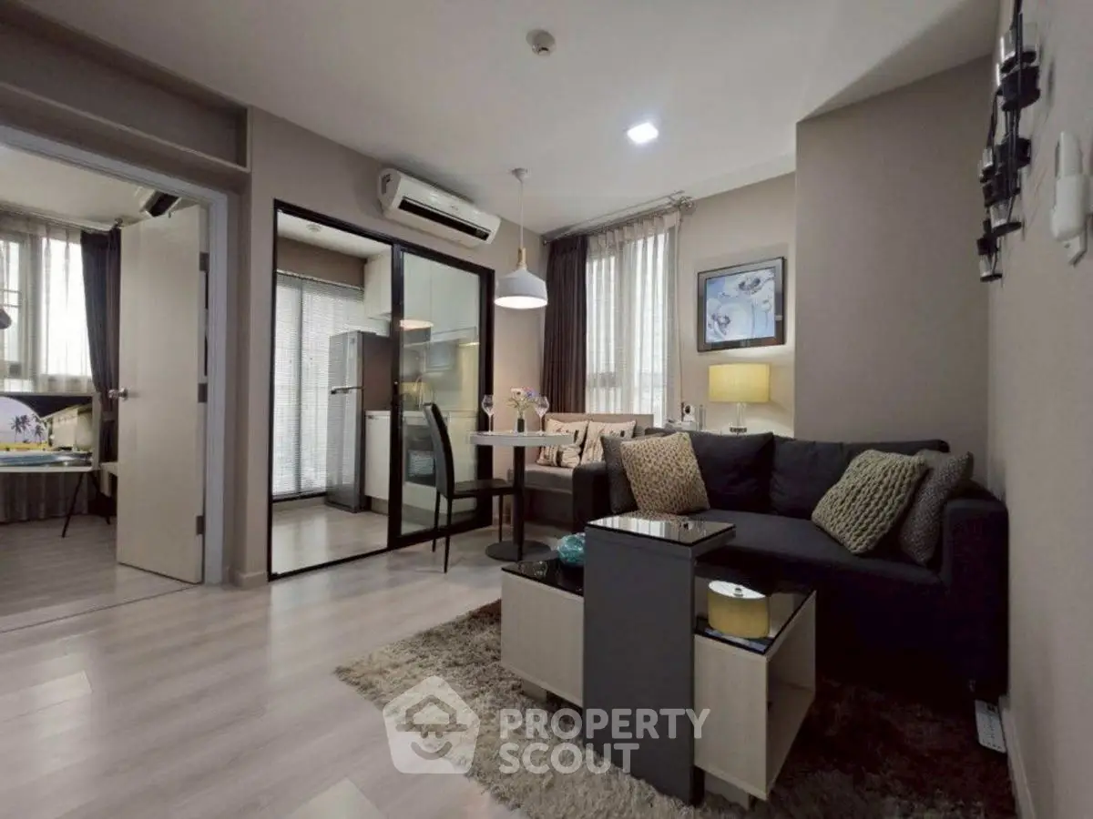 Modern living room with open layout and stylish decor in a cozy apartment.