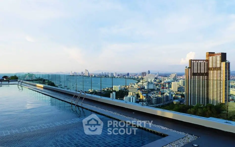 Stunning rooftop pool with panoramic city and ocean views, perfect for luxury living.