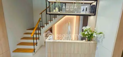 Stylish modern staircase with elegant wooden steps and decorative shelving.