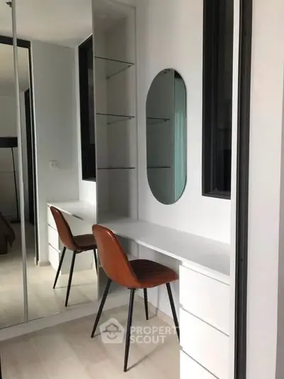 Modern study nook with sleek design and stylish chair in a contemporary apartment.