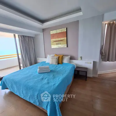 Spacious bedroom with ocean view and modern decor
